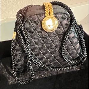 Dressy Black Satin Purse. Gold tone closure.
